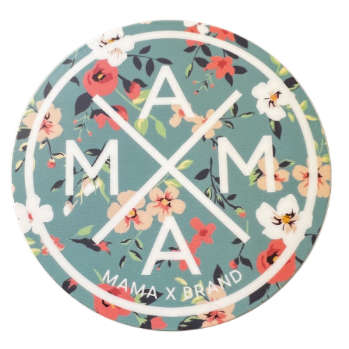 A circular Mama X™ Flower Sticker, with a teal background adorned with red, white, and pink floral patterns. The text "MAMA" is displayed in a cross layout in the center, reflecting a Floral Mama X design. At the bottom of the sticker, within the circle, "Mama X™ Brand" is inscribed.