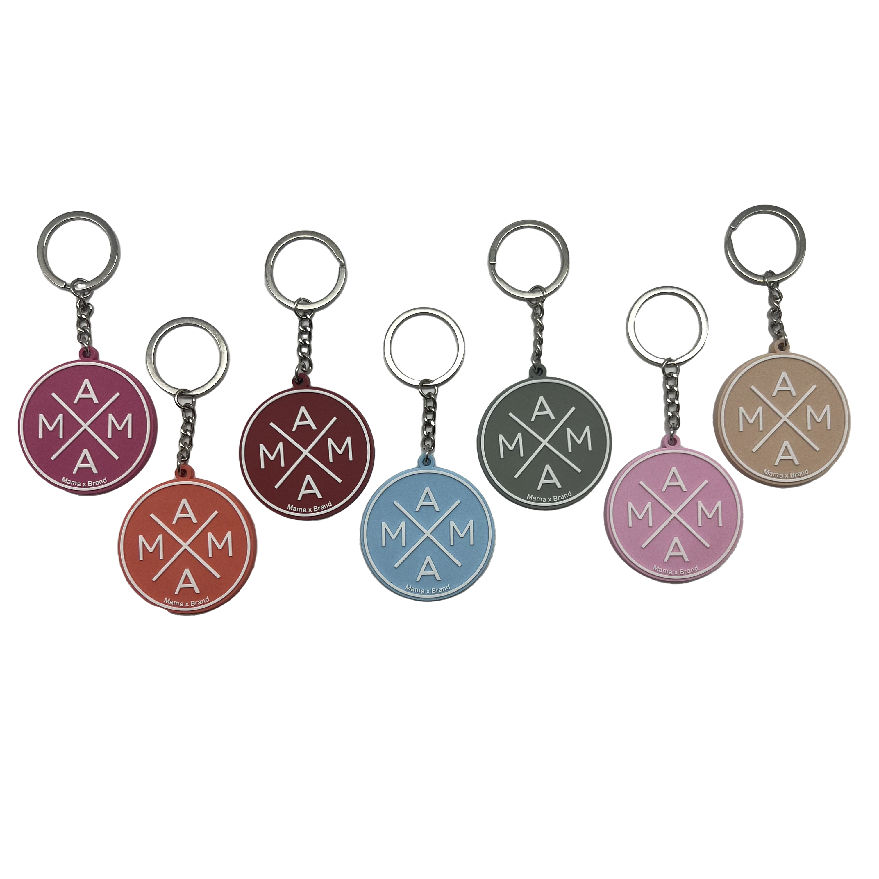 A set of seven Mama X™ Keychains from the Mama X™ Brand arranged in a horizontal row, each in a distinct color. Featuring an 