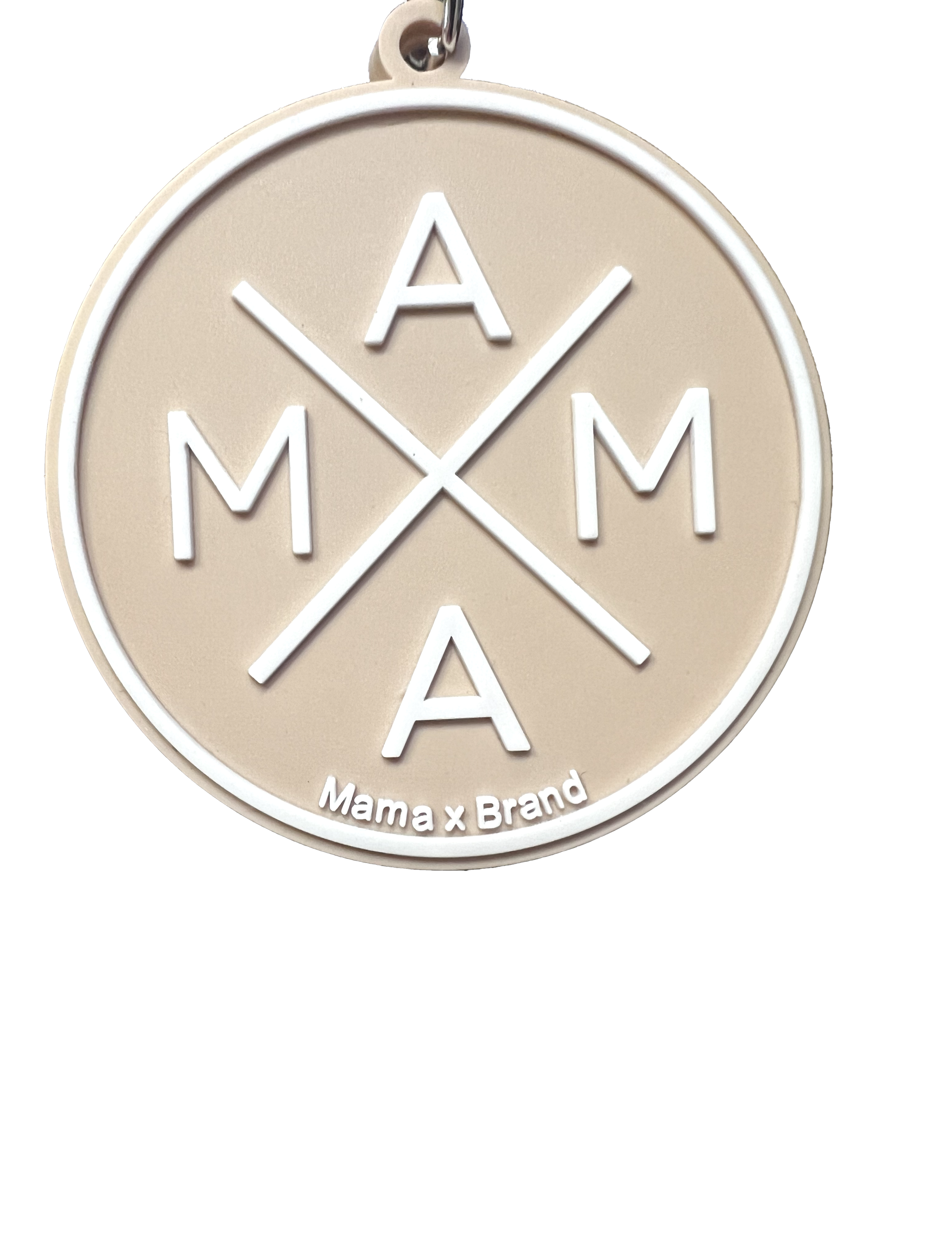 A beige circular Mama X™ Keychain from Mama X™ Brand features a unique crisscross design where the letters 