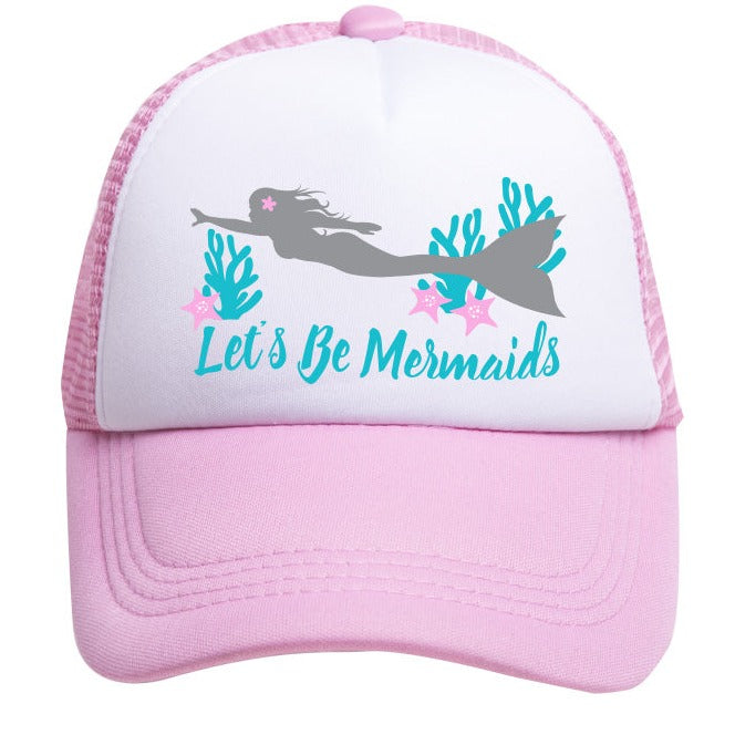 The "Let's Be Mermaids" Trucker Hat by Mama X™ Brand features a pink and white 5-panel design with a silhouette of a mermaid swimming with two starfish and seaweed. Beneath the illustration, the text reads "Let's Be Mermaids" in turquoise font. The polyester front and nylon mesh back ensure comfort and breathability for all-day wear.