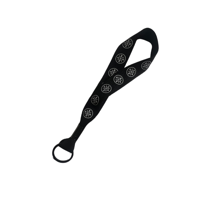 The Mama X™ Keychain/Lanyard by Mama X™ Brand is a versatile black elastic stretch band featuring a loop at one end and multiple circular white symbols along its length, perfect for stretching exercises or as a handy mom accessory, isolated on a white background.