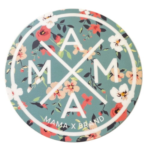 A circular Mama X™ Flower Sticker, with a teal background adorned with red, white, and pink floral patterns. The text 