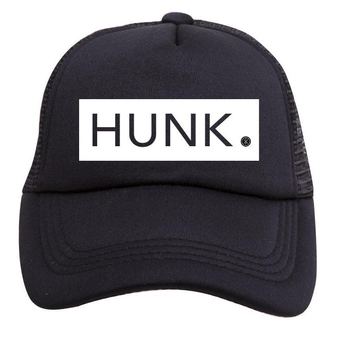 A black Hunk Trucker Hat from Mama X™ Brand, featuring the word "HUNK" printed in bold white letters on the front. Perfect for boy moms, this hat has a solid front panel and a breathable mesh back.