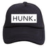 A black Hunk Trucker Hat from Mama X™ Brand, featuring the word "HUNK" printed in bold white letters on the front. Perfect for boy moms, this hat has a solid front panel and a breathable mesh back.