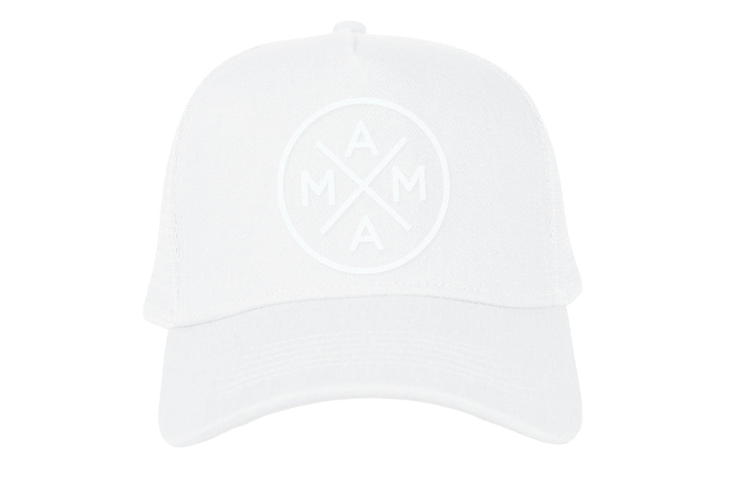 The Mama X™ Whiteout Premium Trucker Hat from the Mama X™ Brand is a white cotton canvas cap featuring a circular logo with the acronym 