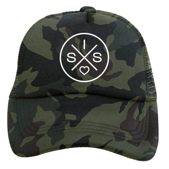The Sis X Green Camo Trucker Hat by Mama X™ Brand showcases a striking white circular SIS X logo on the front. This 5-panel cap highlights an "X" formed by four intersecting lines, with the letters "I", "S", and "S" along with a heart symbol at each point of the "X".