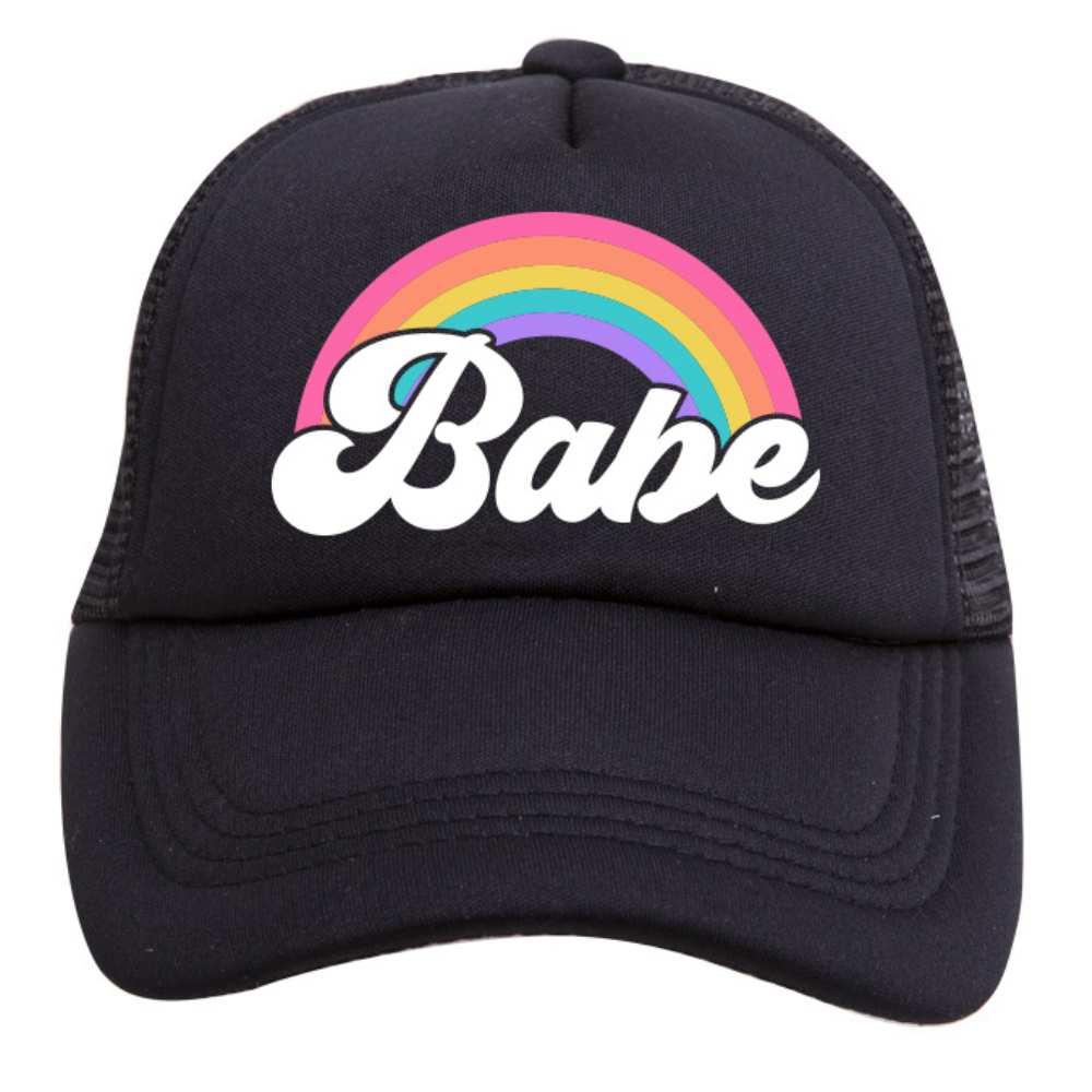 The Rainbow Babe Trucker Hat from Mama X™ Brand is a black 5-panel cap featuring the word 